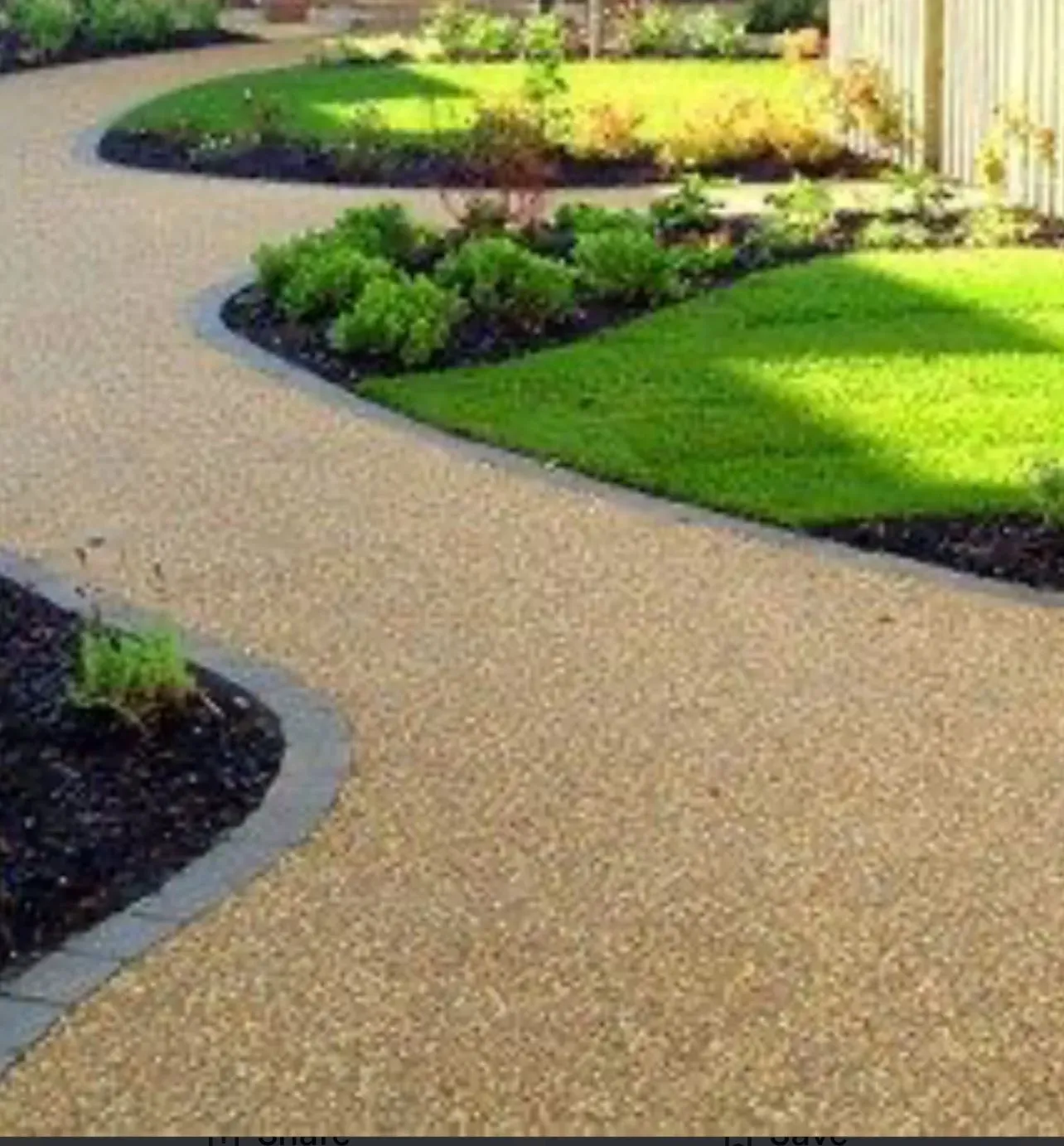 Landscaped garden featuring a curving resin-bound path with block paved edging and freshly laid lawn