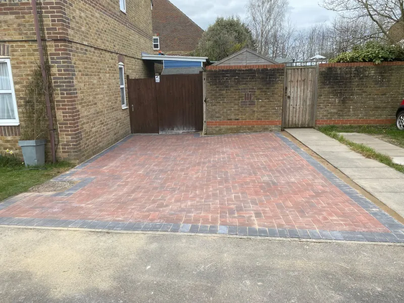 Completed block paving driveway installation with red herringbone paving